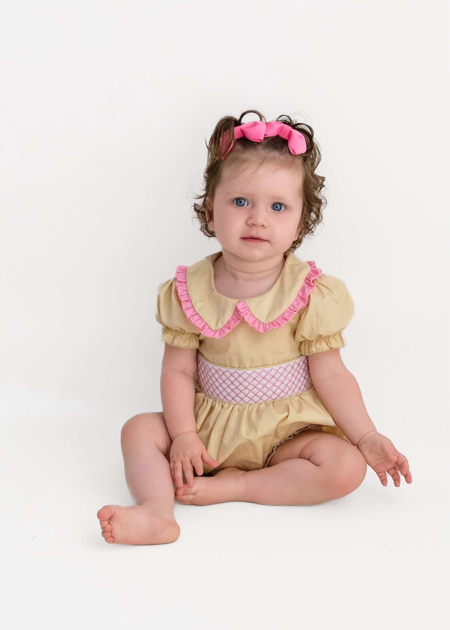 Cream & pink smocked baby girls rompers