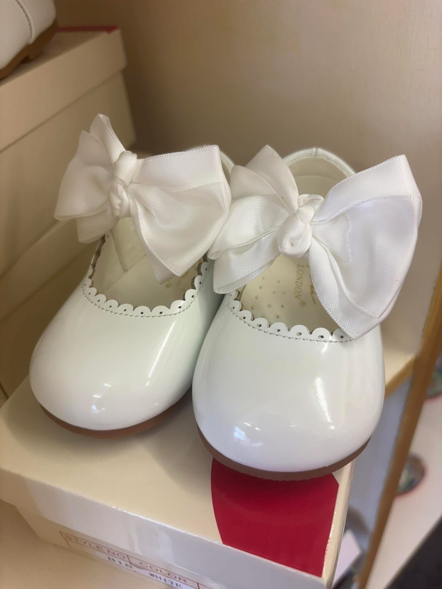Tia London , girls white patent shoes